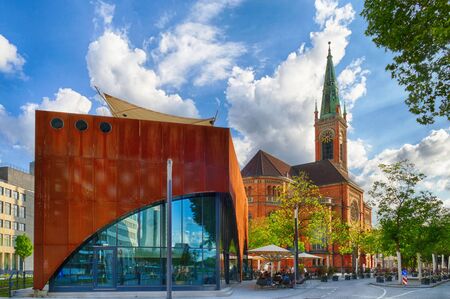 Historical church and new building in the center of Duesseldorf in Germanyの写真素材