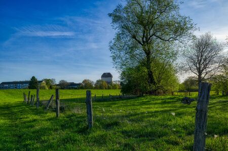Dike, shire and water tower in Hohenbudbergの写真素材