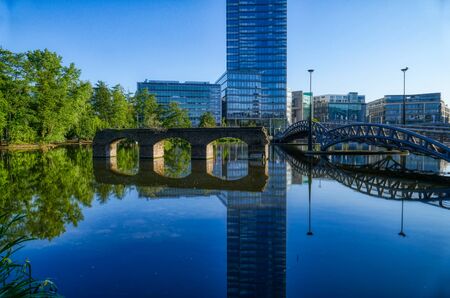 A pond and bridges in a public business park in Cologneの写真素材