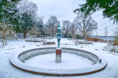 Fountain with statue in a park by the Rhine in Dusseldorfの写真素材