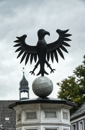 Eagle sculpture on a water pump in the historical center of Dinslakenのeditorial素材