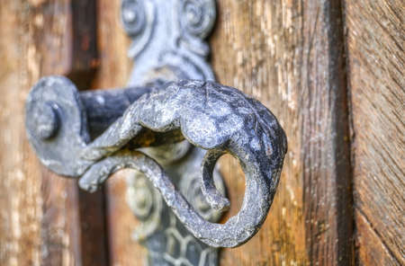 Door handle of an old doorの写真素材