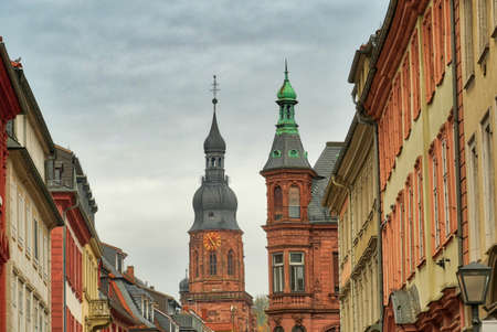 Historical church tower and old buildings in the center of Heidelbergの写真素材