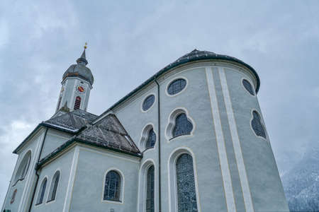 Historical church and houses in Garmisch-Partenkirchenの写真素材