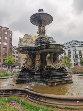 Historical fountain in a park in downtown Dusseldorfの写真素材