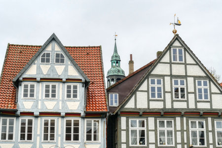 Historical half-timbered facades and church tower in Celle