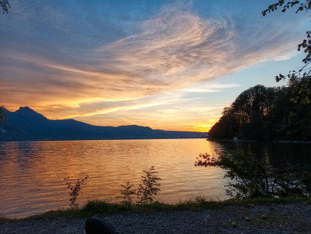 Sunset at lake Kochelsee and Alpsの写真素材