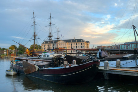 Historical harbor with a sail ship in Amsterdamの写真素材