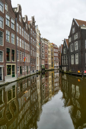 Town canal and historical buildings in old Amsterdamの写真素材