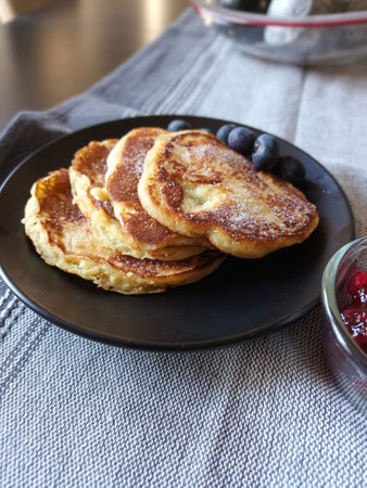 Fresh pancakes with cranberry jam and blueberriesの写真素材