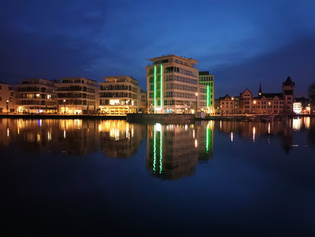Buildings at lake Phoenix in Dortmund at nightの写真素材