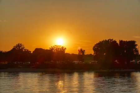 Sunset over the Rhine at a camping site near Kaiserswerthの写真素材