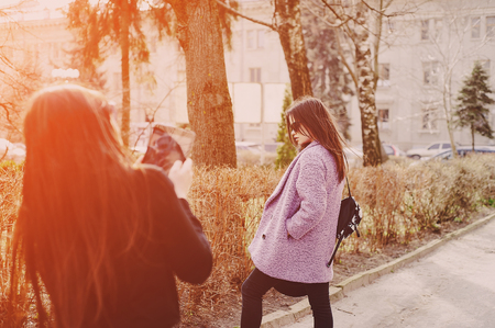the girls photographed each other stylish and trendy young modelsの写真素材
