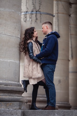 couple in love walking around the city and the river