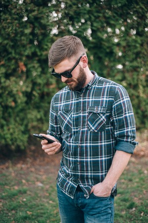 Man with telephone headset and walks around the cityの写真素材