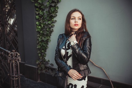 The girl walks sunny cityの写真素材