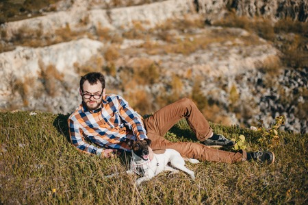 boy on a walk in the woods with the dogの写真素材