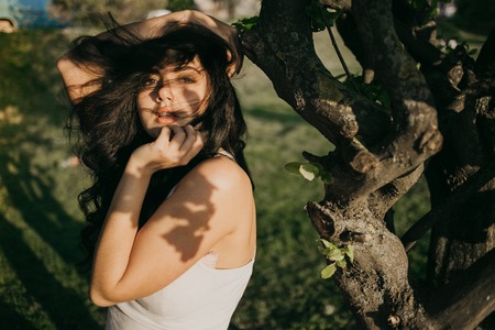Girls walking around town, sit in cafes and pictures on phonesの写真素材