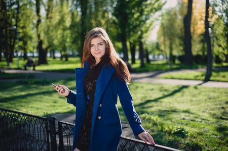 beautiful lady walks in sun cityの写真素材