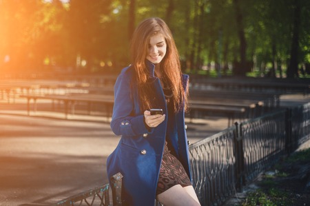 beautiful lady walks in sun cityの写真素材