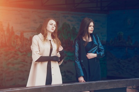 Two pretty girls walking in the city