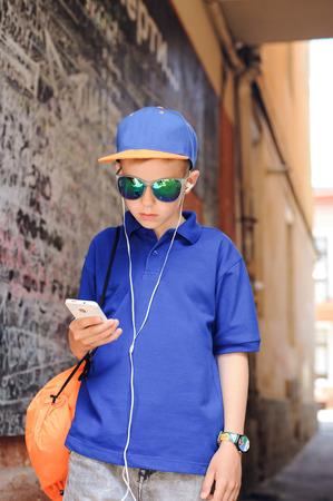 mother with son on a walk around townの写真素材