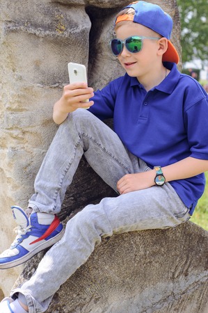 mother with son on a walk around townの写真素材