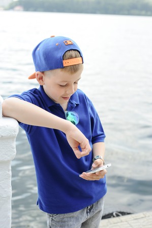 mother with son on a walk around townの写真素材