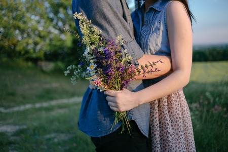 Loving couple walking on the fieldの写真素材