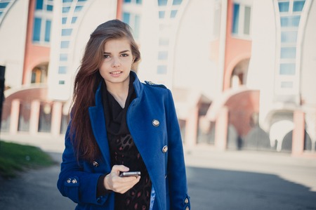 beautiful lady walks in sun cityの写真素材