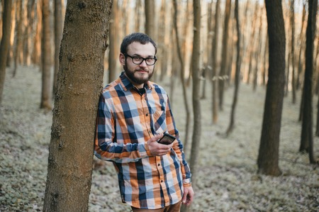 boy on a walk in the woods with the dogの写真素材