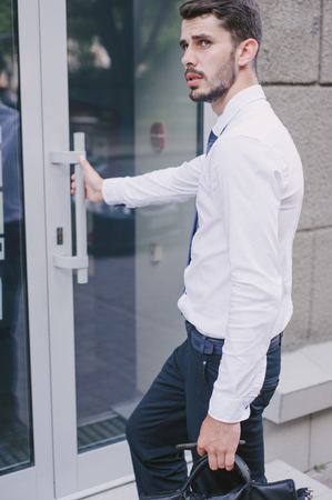 Businessman walking city, park and sitting in cafesの写真素材