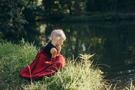girl walking in the park near the river