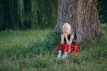 girl walking in the park near the riverの写真素材