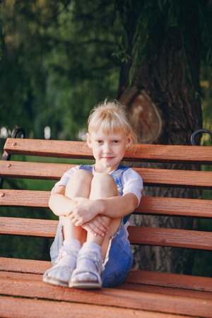 girl walking in the park near the riverの写真素材