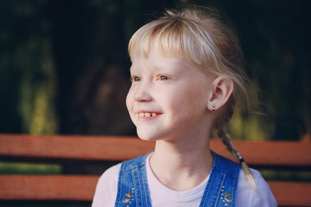 girl walking in the park near the riverの写真素材
