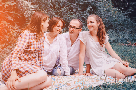 happy family on a picnic. play with the dog. good time.の写真素材