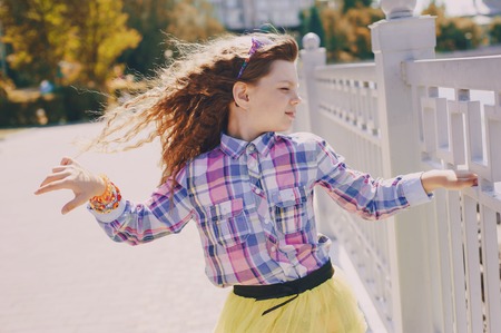 girl walking park eating ice cream good time using communicationの写真素材