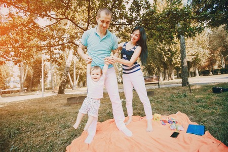 family picnic at a good time. uses the means of communication. sitting in cafeの写真素材