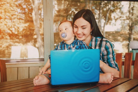 family picnic at a good time. uses the means of communication. sitting in cafeの写真素材
