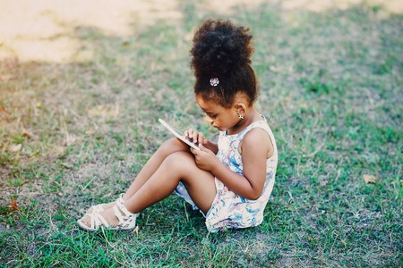 little girl walking park. uses communication. playing on the playground