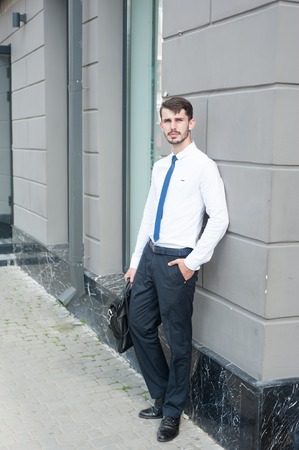 Businessman walking city, park and sitting in cafesの写真素材