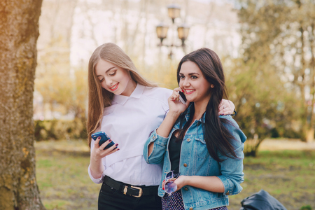 Girls walking around the city and make selfieの写真素材