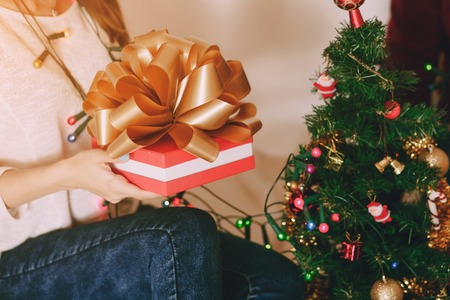 loving couple decorating Christmas tree. uses communication. give gifts