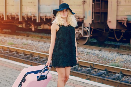 beautiful girl at raiway station. uses communicationの写真素材