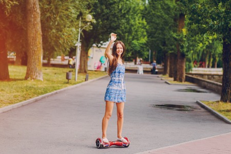 Beautiful girl is walking around the city and admire good location