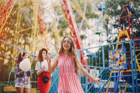 three stylish girls walking city and playgroundの写真素材