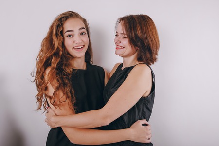 Mom and daughter decorate Christmas tree. give gifts. pictures. good timeの写真素材