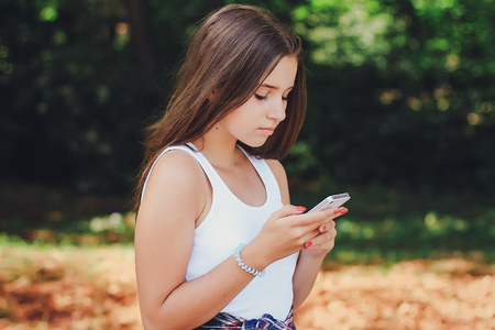 young beautiful girl walking parkの写真素材