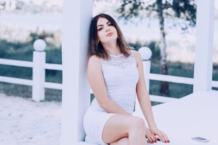 two girls resting on the beachの写真素材